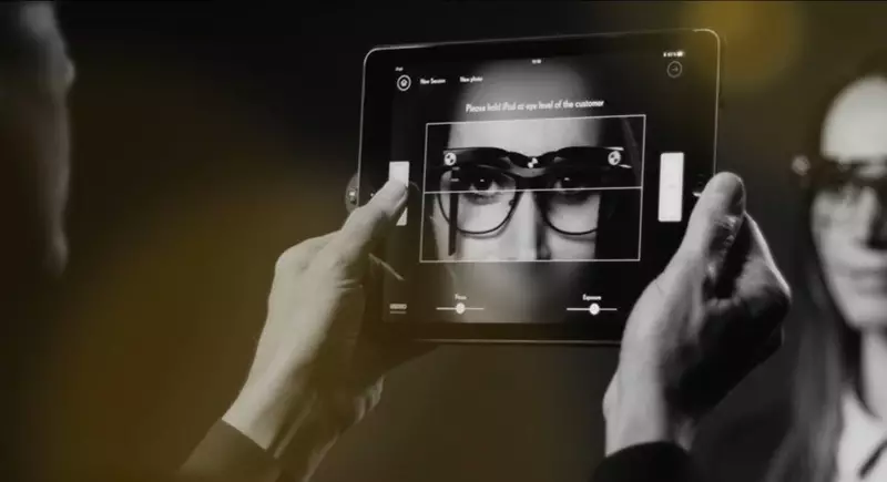 Black and white image of a female having eyeglasses measured using ipad 