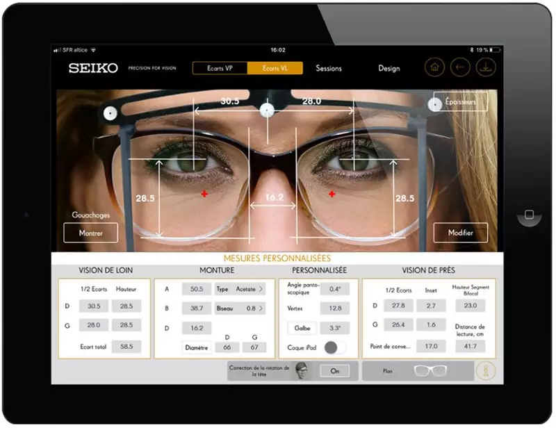 Tablet screen showing measurements of eyeglasses on a female face