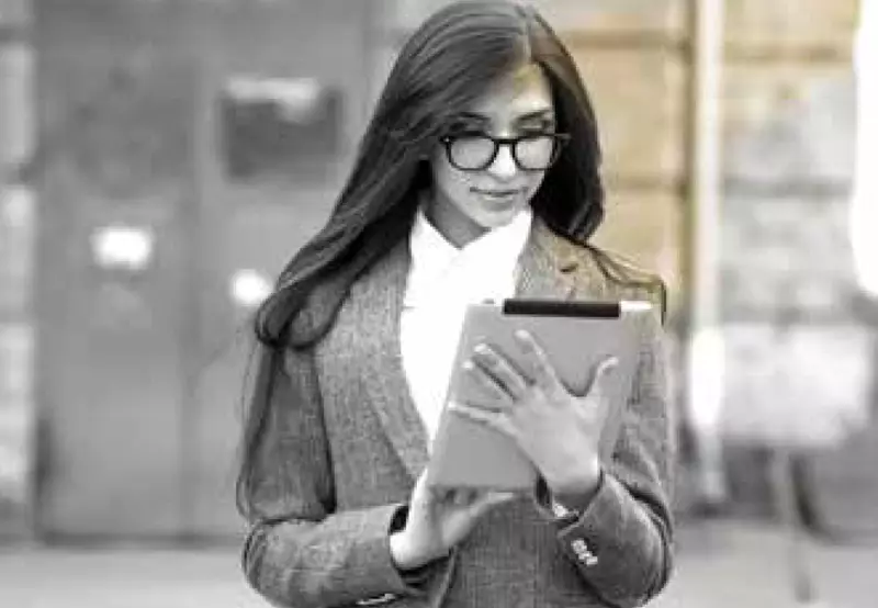 Female wearing eyeglasses on tablet