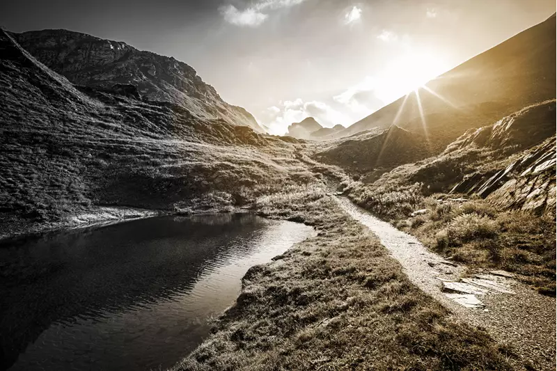 Mountain landscape shot of mountains with the sun shining over them